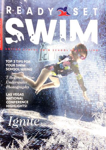magazine cover with a kid swimming 