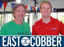 ASA's addition of SwimFIT in the East Cobber Magazine Two swim teachers taking a picture together for east cobber magazine