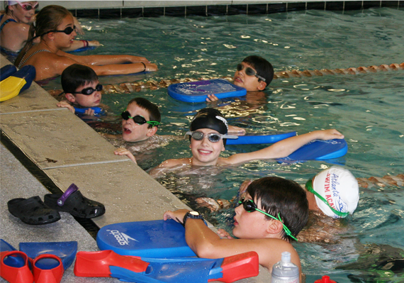 Two girls about to race in a swimming competition.